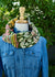 
          
            A bright green and cheerful floral print cowl hangs on a mannequin wearing a denim shirt. The cowl is called Scandi Bloom and is ispired by Scandinavian style print patterns.
          
        