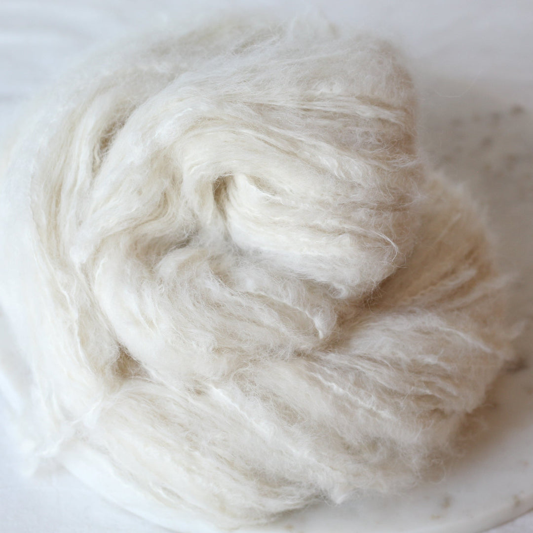 cream yarn on a marble plate