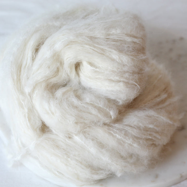 cream yarn on a marble plate