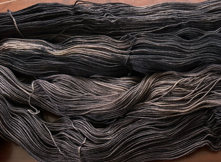 Brown and Black skeins of yarn
