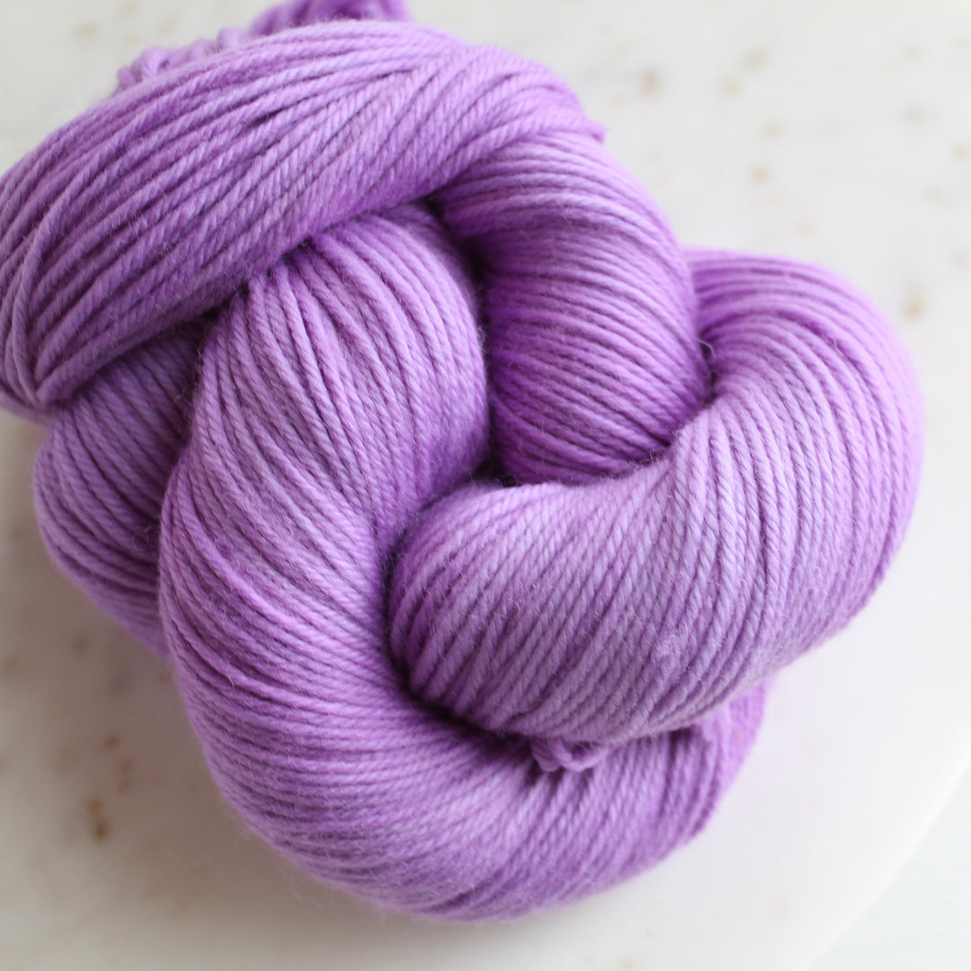 Lavender purple yarn on marble plate