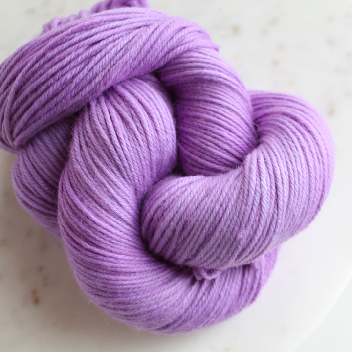 Lavender purple yarn on marble plate