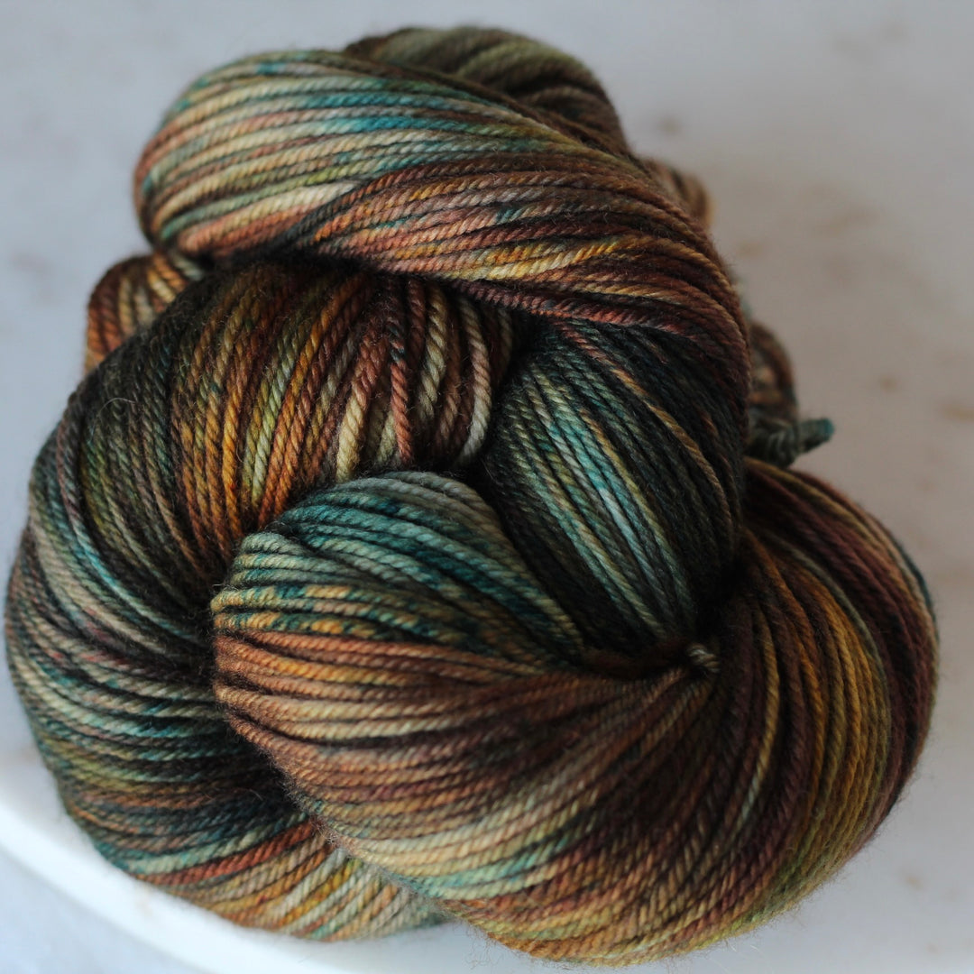 Multicolored skein of yarn on a white background